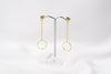 A pair of gold-colored dangle earrings with butterfly backs, displayed against a white background.
