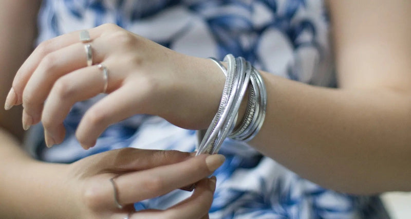 Silver bracelet on a model with a faded background