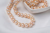 A freshwater champagne pearl necklace displayed on a heart shaped dish