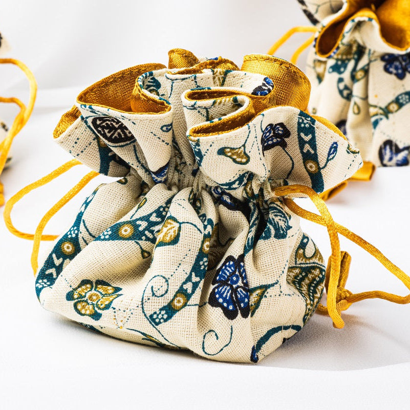 Cloth jewellery pouch on a white background