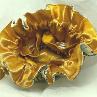 Cloth jewellery pouch on a white background