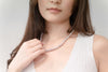 A women wearing a freshwater pearl necklace 