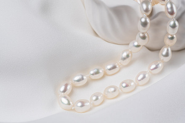 A sterling silver 925 necklace with fresh water pearls, showing the luster and shape of the pearls.