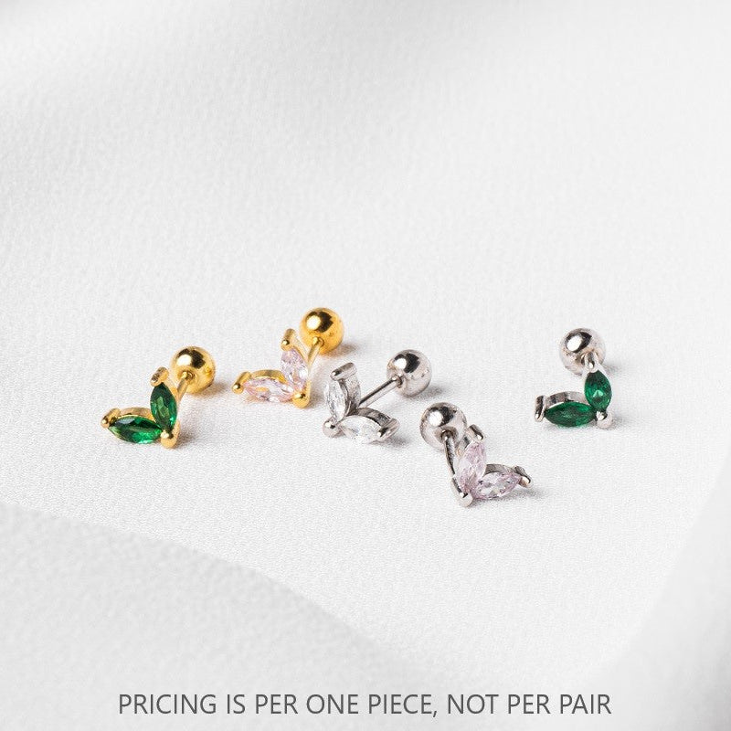 A selection of single earring pieces with green and clear gemstones, and gold vermeil detailing, displayed on a white surface. The text 'PRICING IS PER ONE PIECE, NOT PER PAIR' is visible.