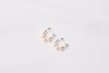 A pair of semi-dangle pearl earrings, made of sterling silver 925 and white color mini baroque-shaped pearls. On a white background.